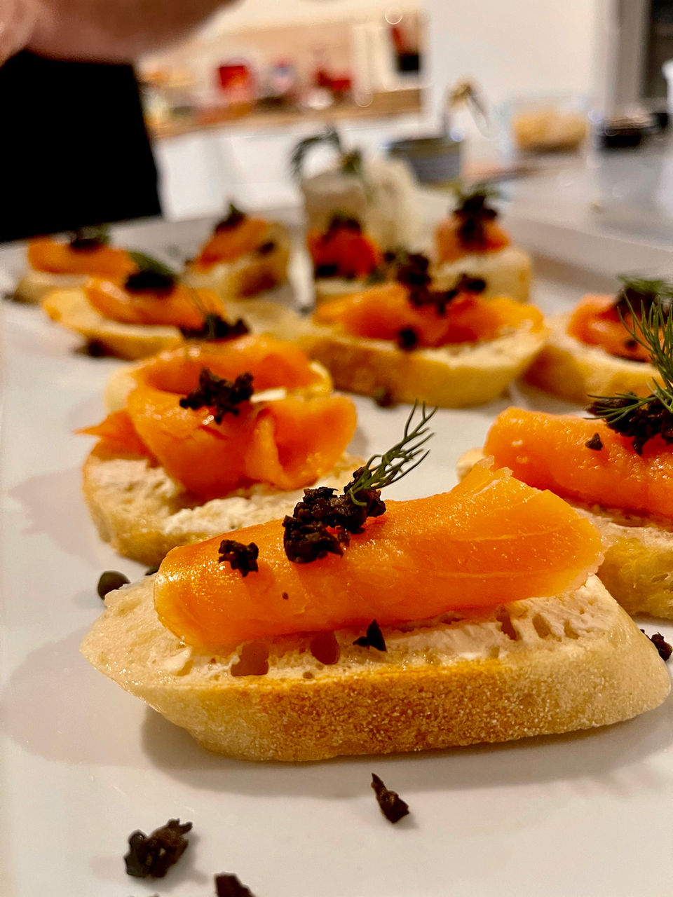 A plated course by Chef William Turner, finished with fresh herbs